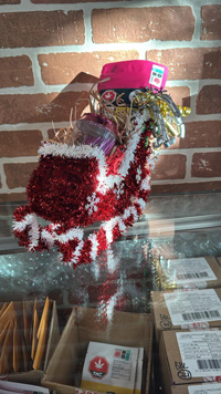 A gift basket in a papier mache stocking